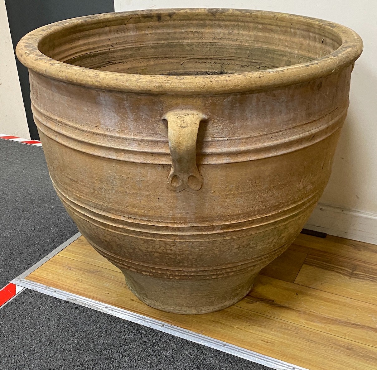 A large circular Grecian style earthenware garden urn, diameter 75cm, height 66cm